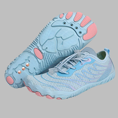 Light blue and pink shoes with textured soles on a white background