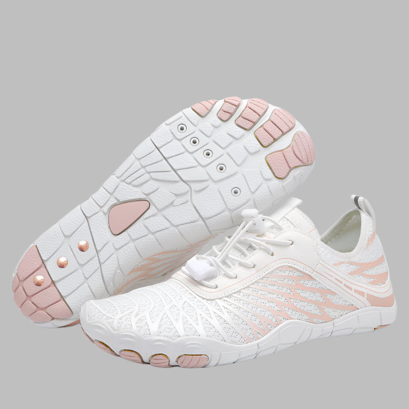 White sneakers with pink soles on a white background