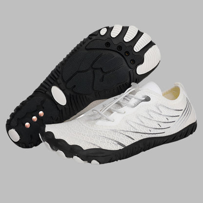 White and black shoes with unique sole design on a white background